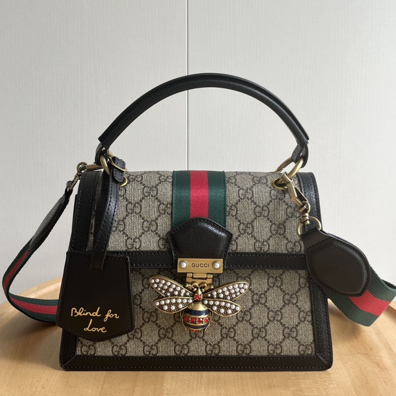G*u*i top handle bags